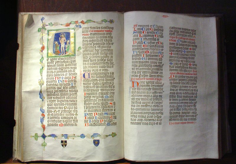 Illuminated manuscript pages from the Liber Pontificalis showing medieval Latin text with decorated initials