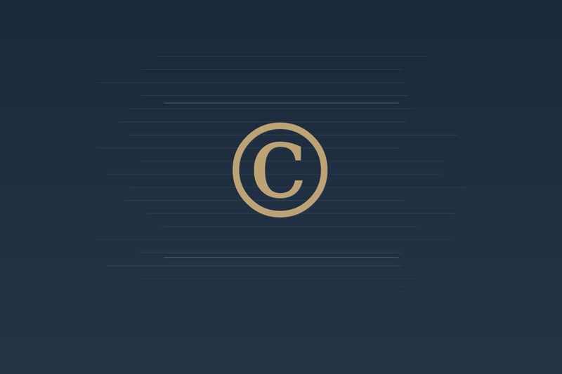 Gold copyright symbol on a dark navy background with subtle document lines
